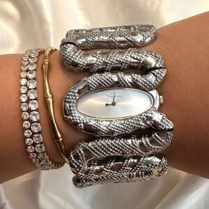 New $640 Roberto Cavalli Cleopatra Women's Analog Silver
Tone Snake Watch
